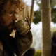 A clearly drunk Tyrion takes another drink while a silent Varys watches on.